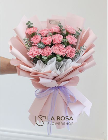 Splendor - A bouquet of dozen pink carnations by LaRosa Flower Shop Quezon City