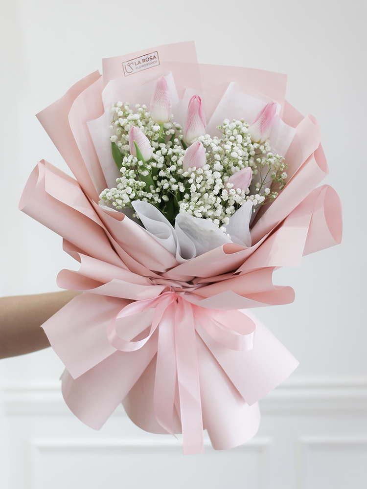 Elegant Tulip Enchantment arrangement in soft-toned blooms for a romantic celebration