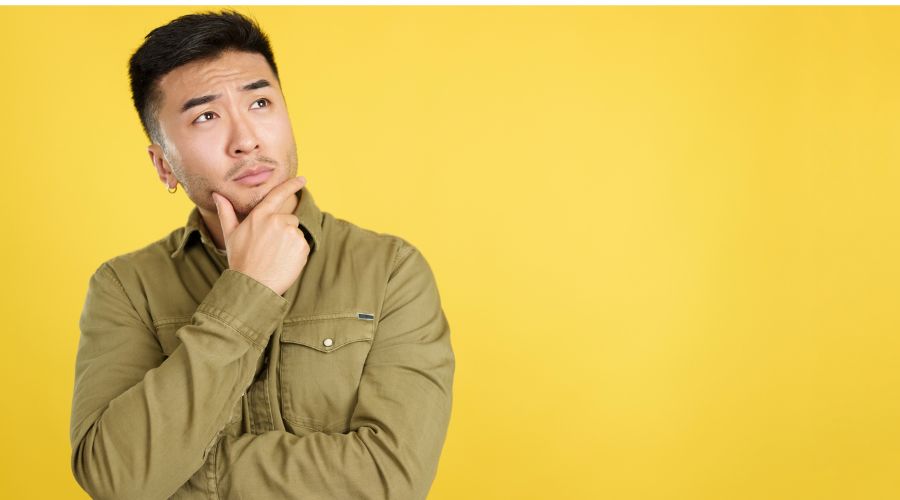 Man thinking about which funeral flowers should he send by la rosa