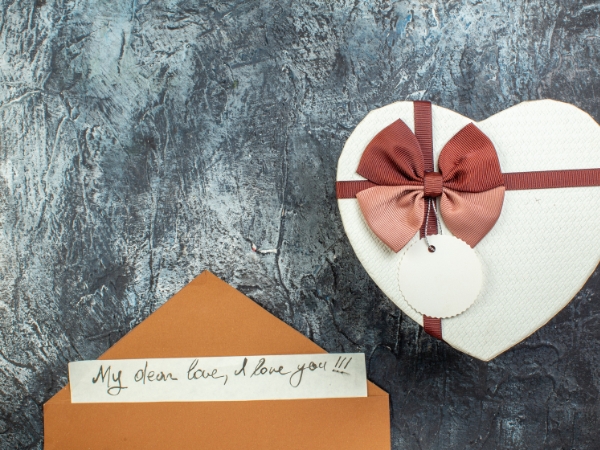 Box of heart with love letter at La Rosa Flower Shop anniversary flower ideas