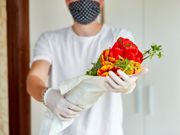 Man giving flowers at La Rosa Flower Shop fathers day flowers